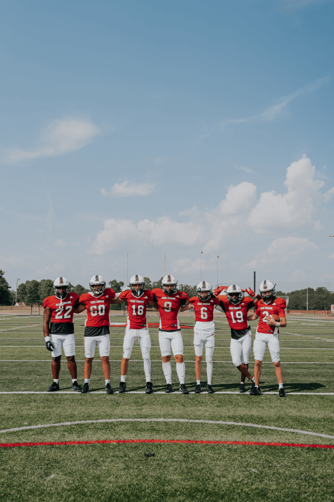 Football game boys teams celebrating their win